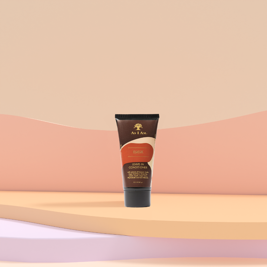 A tube of leave-in conditioner placed on a gradient background, with the product label visible.