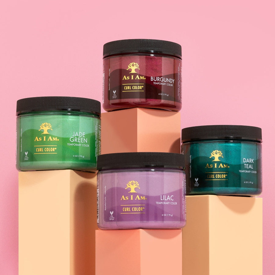 Four jars of As I Am hair color cream on a colorful background