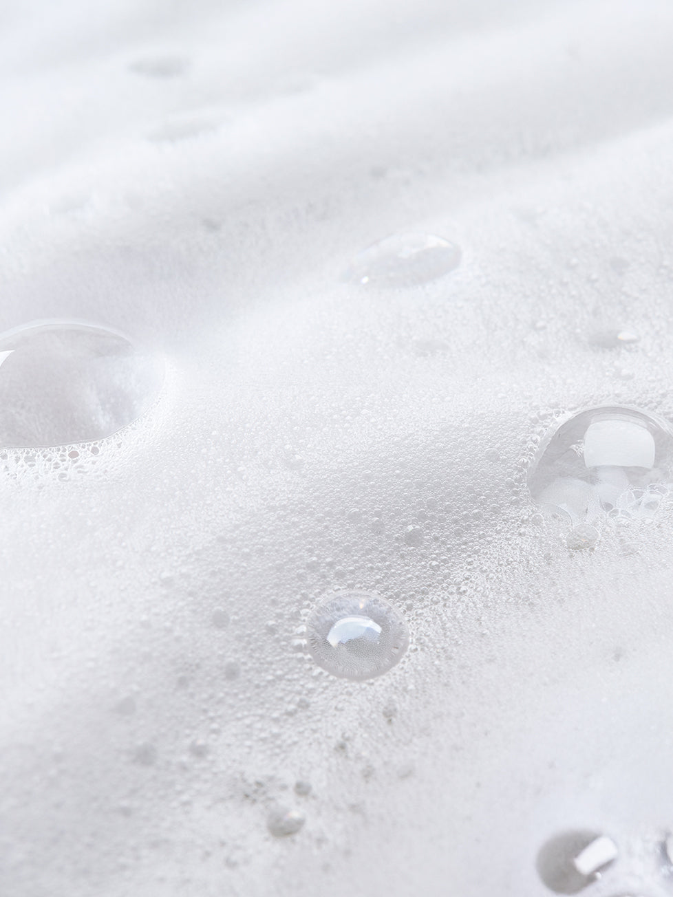 Close-up of bubbles in a white liquid
