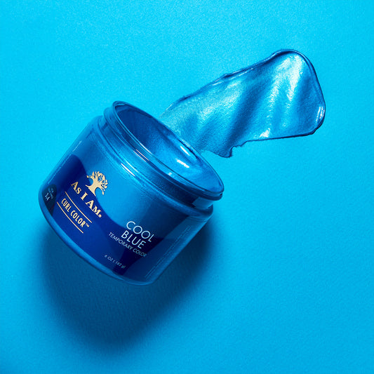 A jar of As I Am Cool Blue curl color gel with a swatch of blue gel extended from the jar, placed on a blue background.