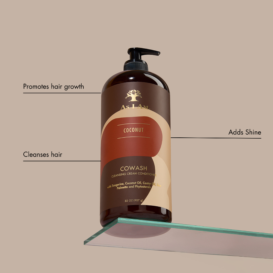 Cowash reinigende crème conditioner fles op een beige achtergrond