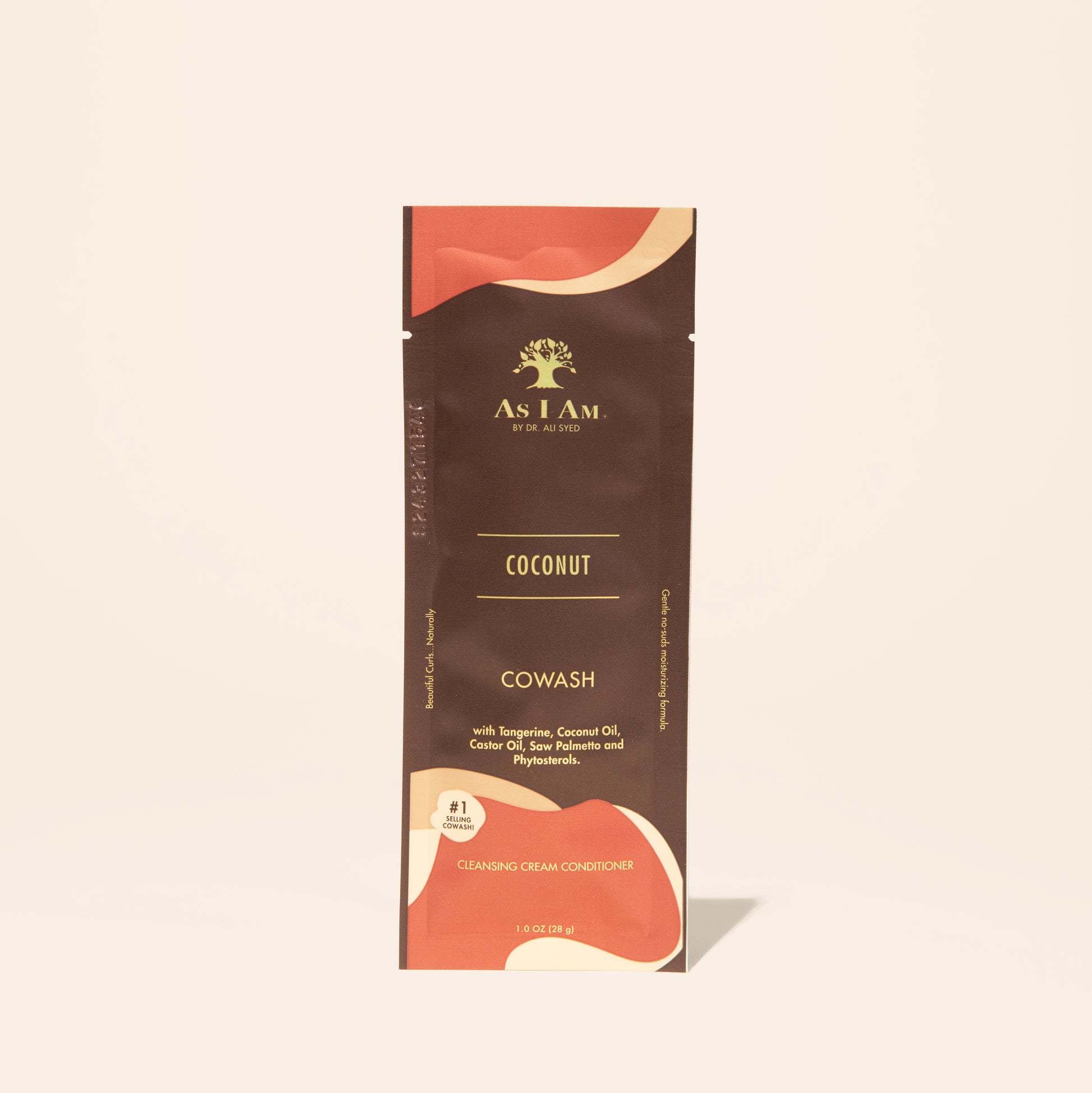 AS I AM Coconut CoWash in a 1 oz sachet, with a creamy, buttery texture—gently cleanses and conditions in one step, removing buildup while moisturizing and detangling textured hair with a refreshing coconut scent.