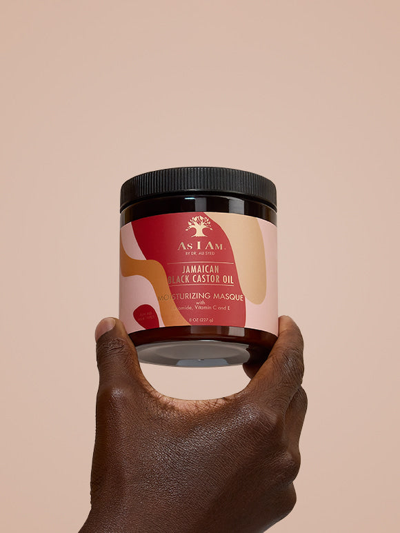 As I Am Jamaican Black Castor Oil Hair Mask — portrait shot of the deep conditioning treatment held in hand, highlighting the rich, restorative formula designed to strengthen and hydrate natural curls with JBCO.