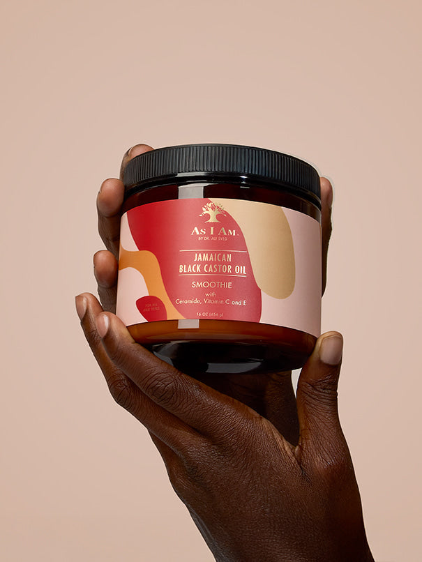 As I Am Jamaican Black Castor Oil Smoothie — portrait shot of the styling cream held in hand, showcasing the rich, moisturizing formula designed to define curls and reduce frizz with nourishing JBCO.