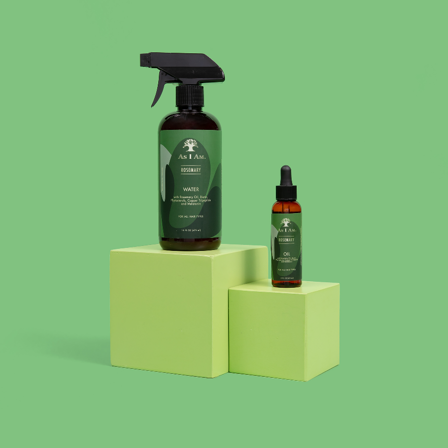 Two bottles of 'As I Am' products on a green background