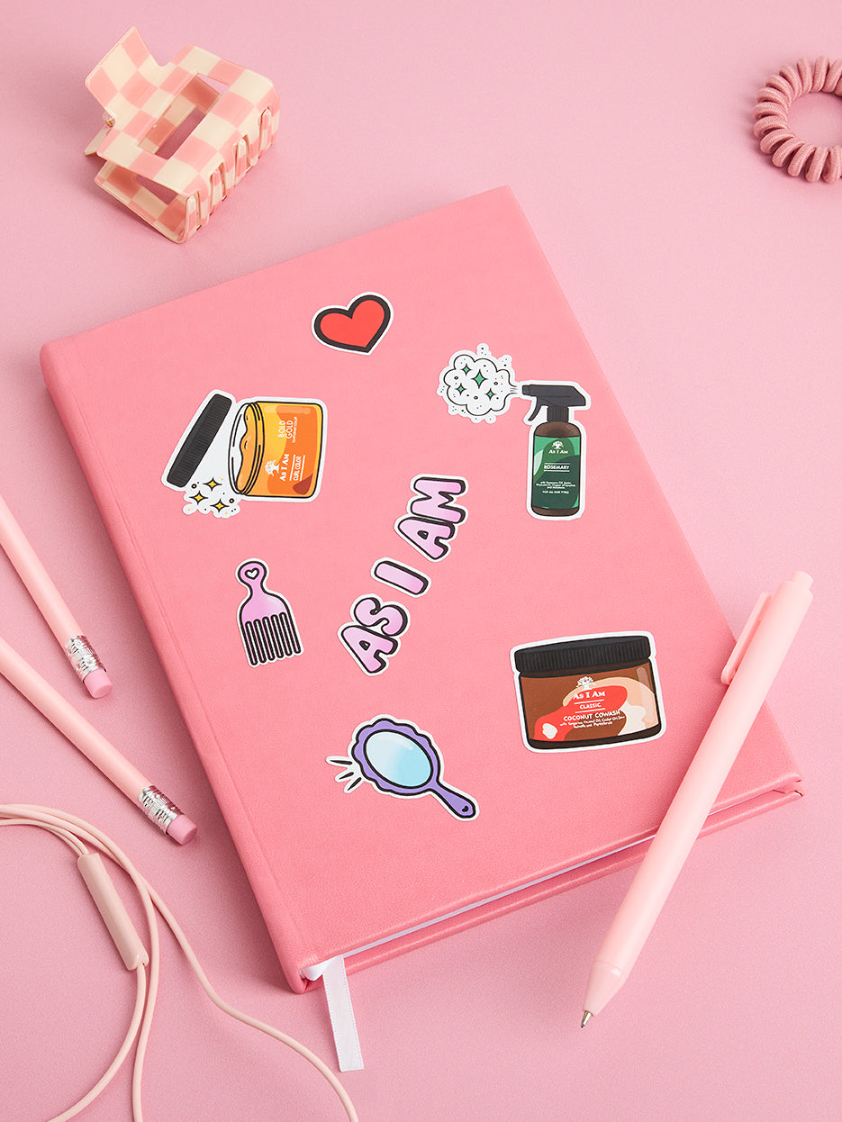 As I Am branded stickers displayed on a notebook — colorful, playful designs showcasing brand identity and curl empowerment, perfect for personalizing journals or planners.