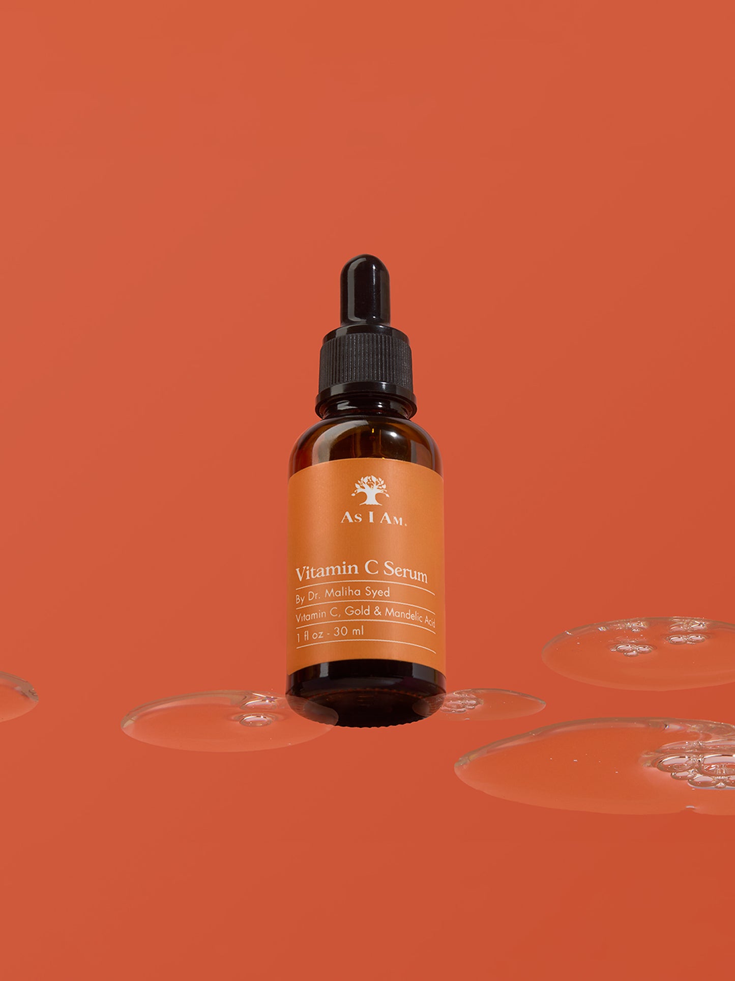 Frasco de suero de vitamina C con gotero sobre fondo naranja