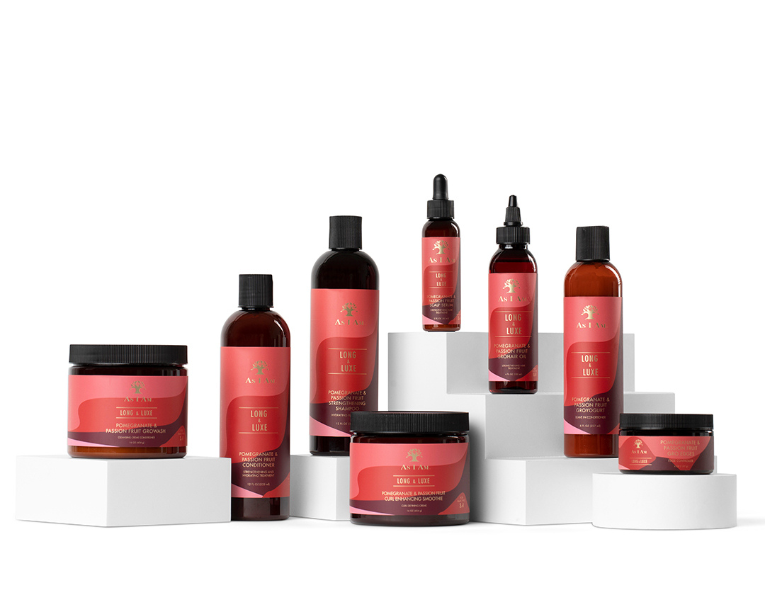 Collection of red haircare products on a white background