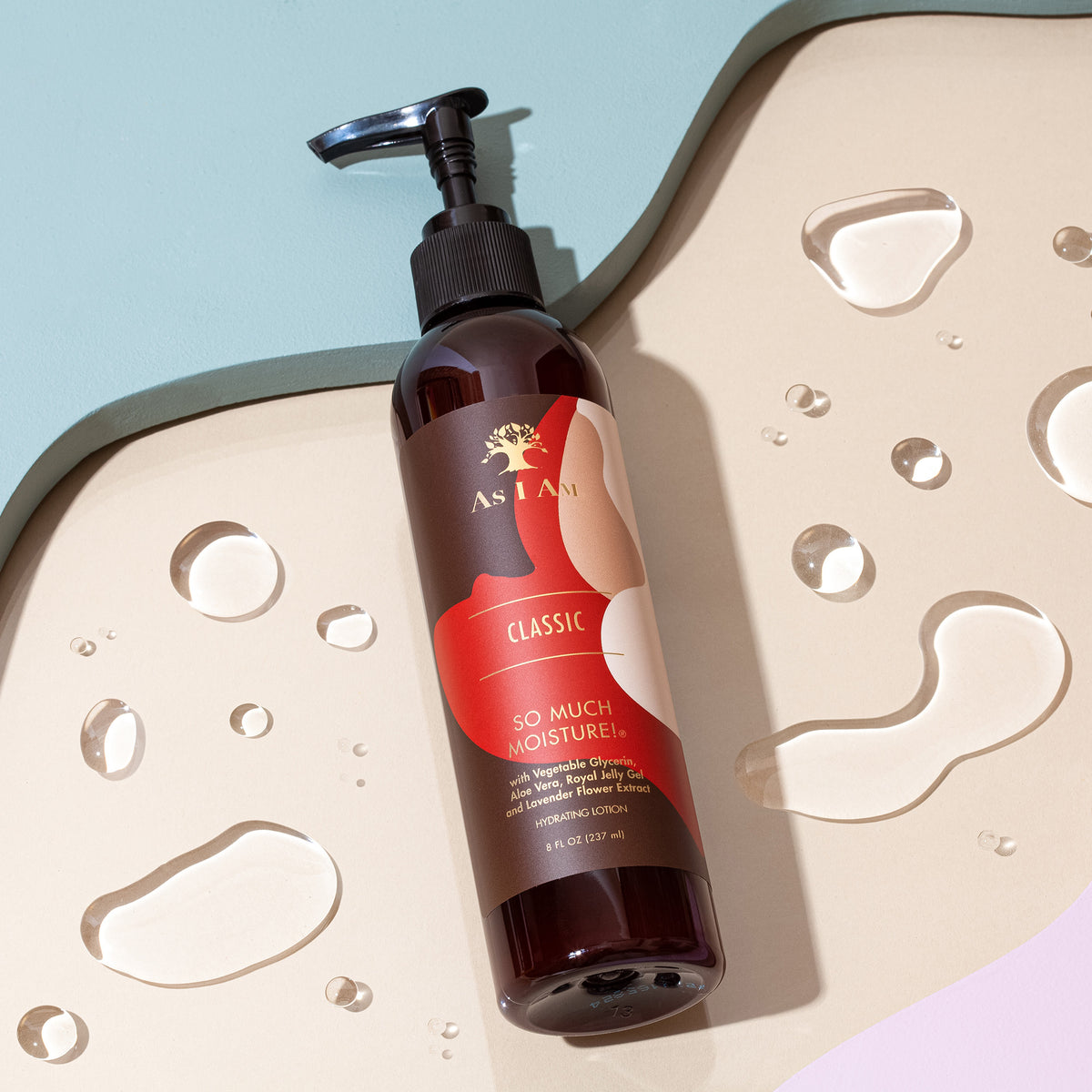 A pump bottle of AS I AM Classic So Much Moisture Hydrating Lotion with water droplets around it, placed on a light background.