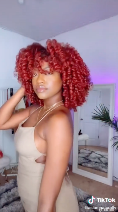 Kimberly Cherrell wearing As I Am Curl Color — showcasing vibrant, defined curls styled with temporary hair color gel, highlighting bold pigment and healthy shine.
