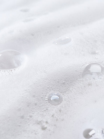 Close-up of bubbles in a white liquid