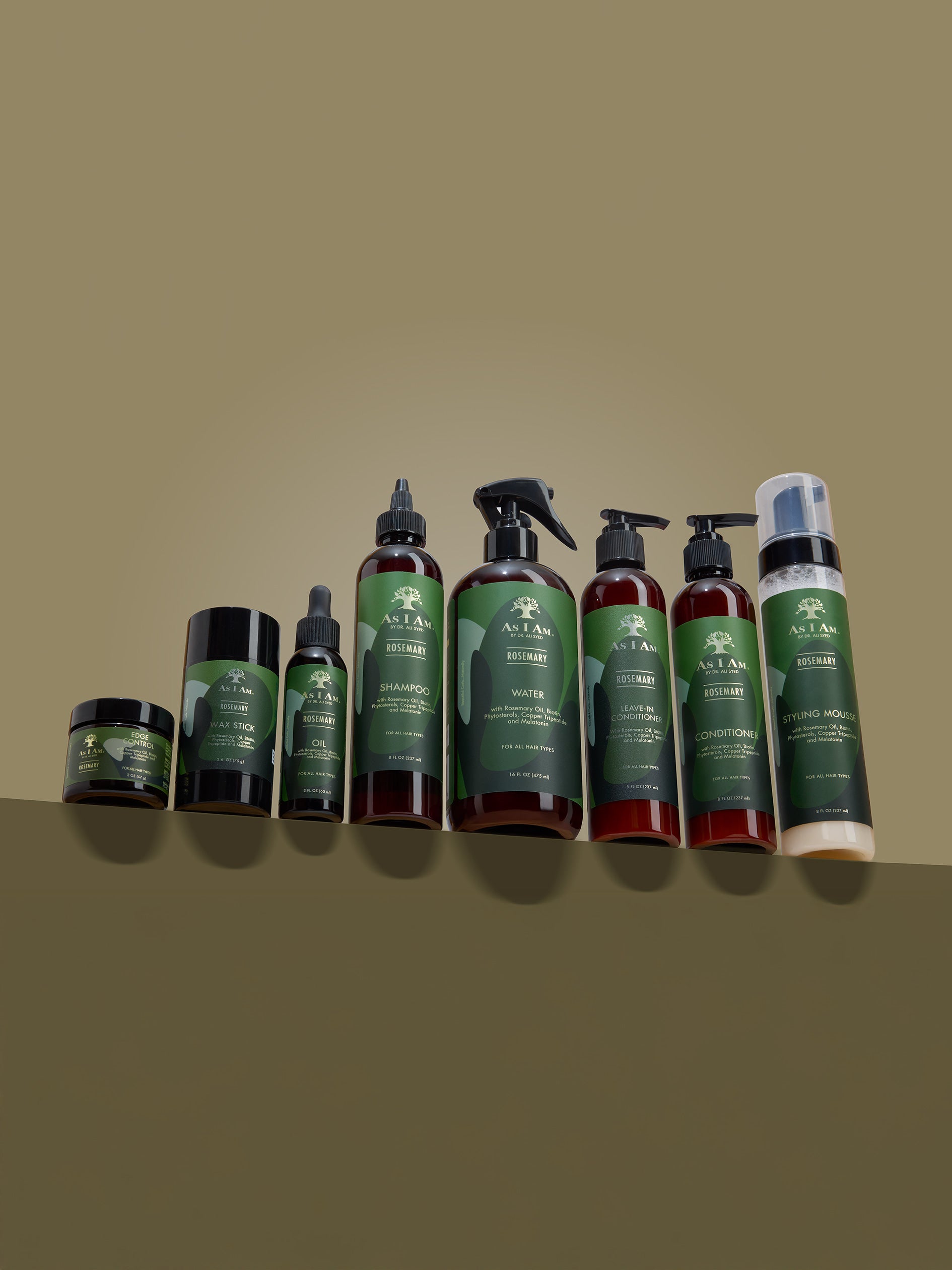 Line of skincare products with green and brown bottles and containers on a matching background