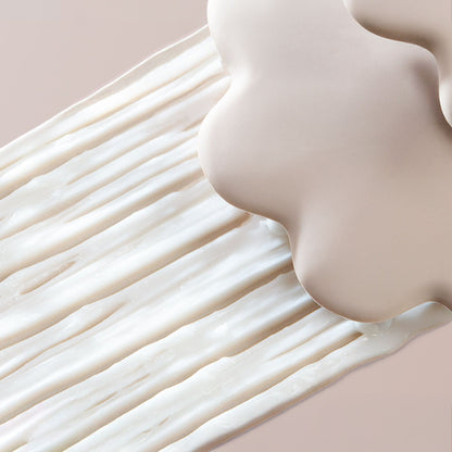 Close-up of a smooth, beige-colored surface with a soft focus effect.