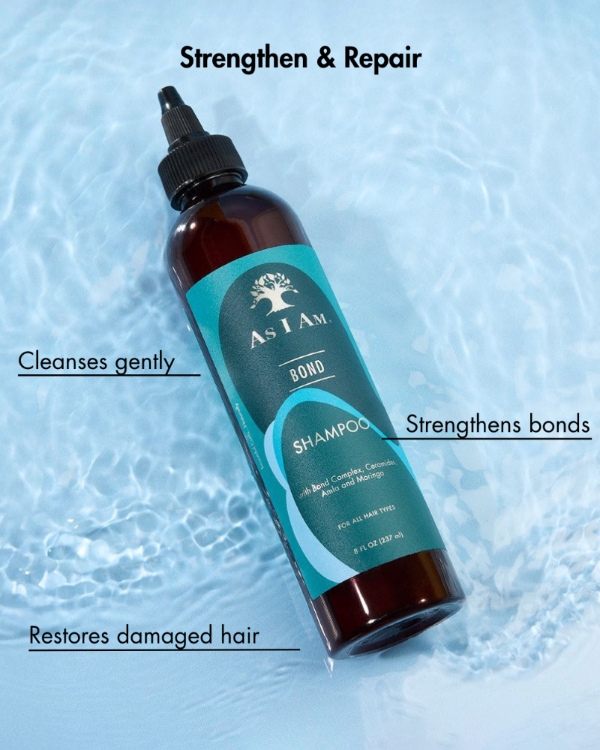 Shampoo bottle with blue label on a textured blue background