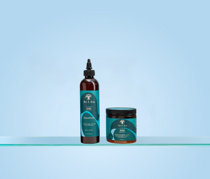 Two bottles of As i am hair care products on a clear shelf with a light blue background