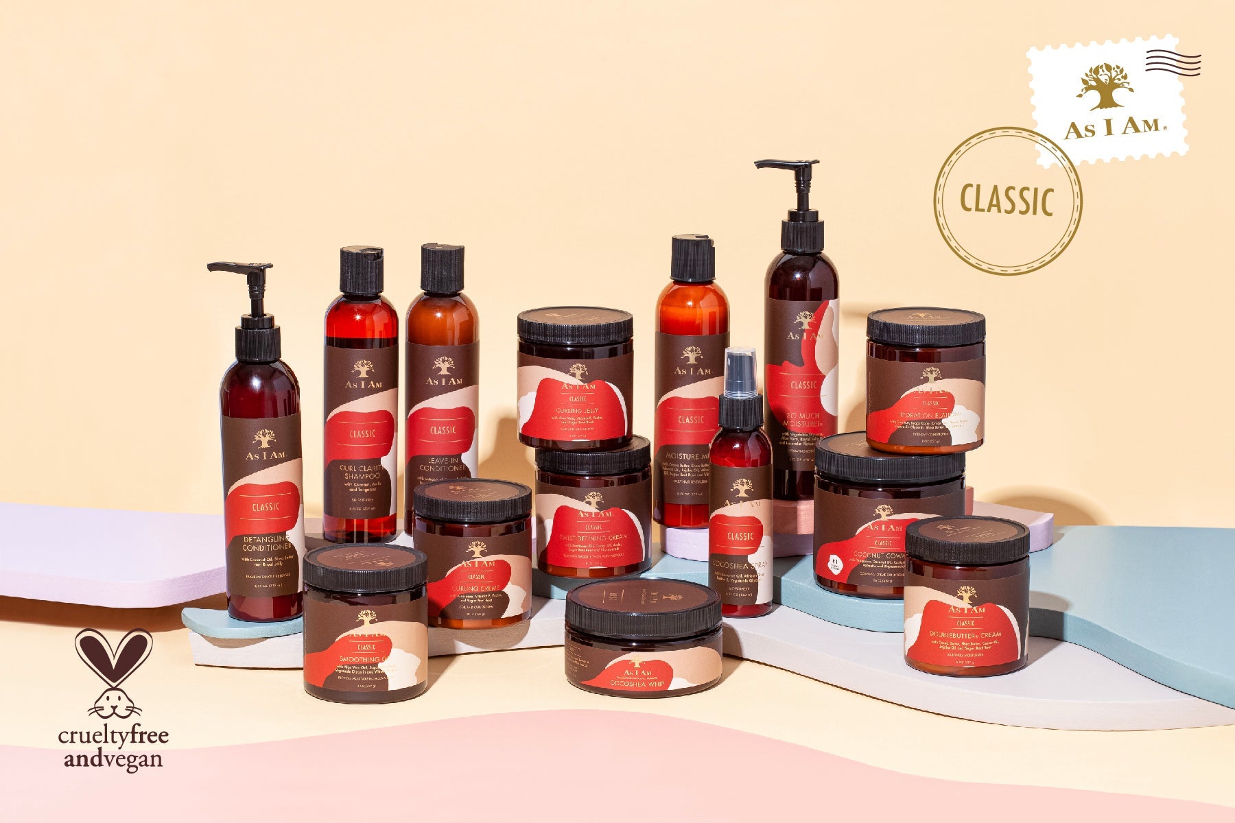 Assorted hair care products on a pink surface with 'as i am' branding.