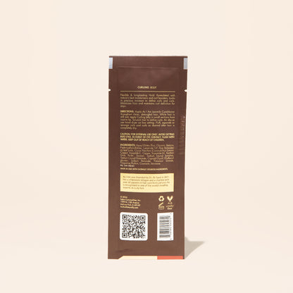 AS I AM Curling Jelly in a 1 oz sachet, showcasing a clear, gel-like texture—formulated to define curls and coils, minimize frizz, and provide long-lasting hold with shine and bounce.
