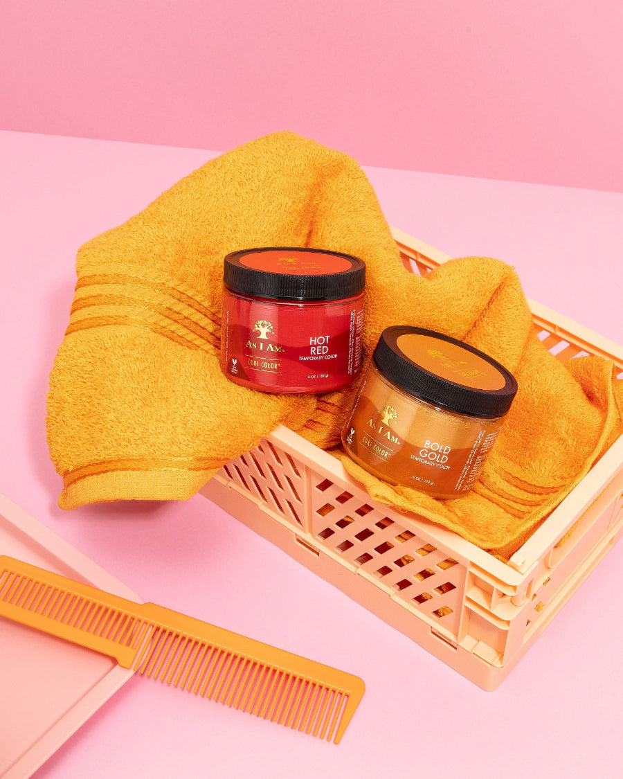As I Am Curl Color in Hot Red and Bold Gold — displayed in a basket, highlighting the vibrant temporary hair color gels designed to define curls with bold pigment and a healthy, damage-free finish.