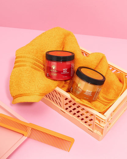 As I Am Curl Color in Hot Red and Bold Gold — displayed in a basket, highlighting the vibrant temporary hair color gels designed to define curls with bold pigment and a healthy, damage-free finish.