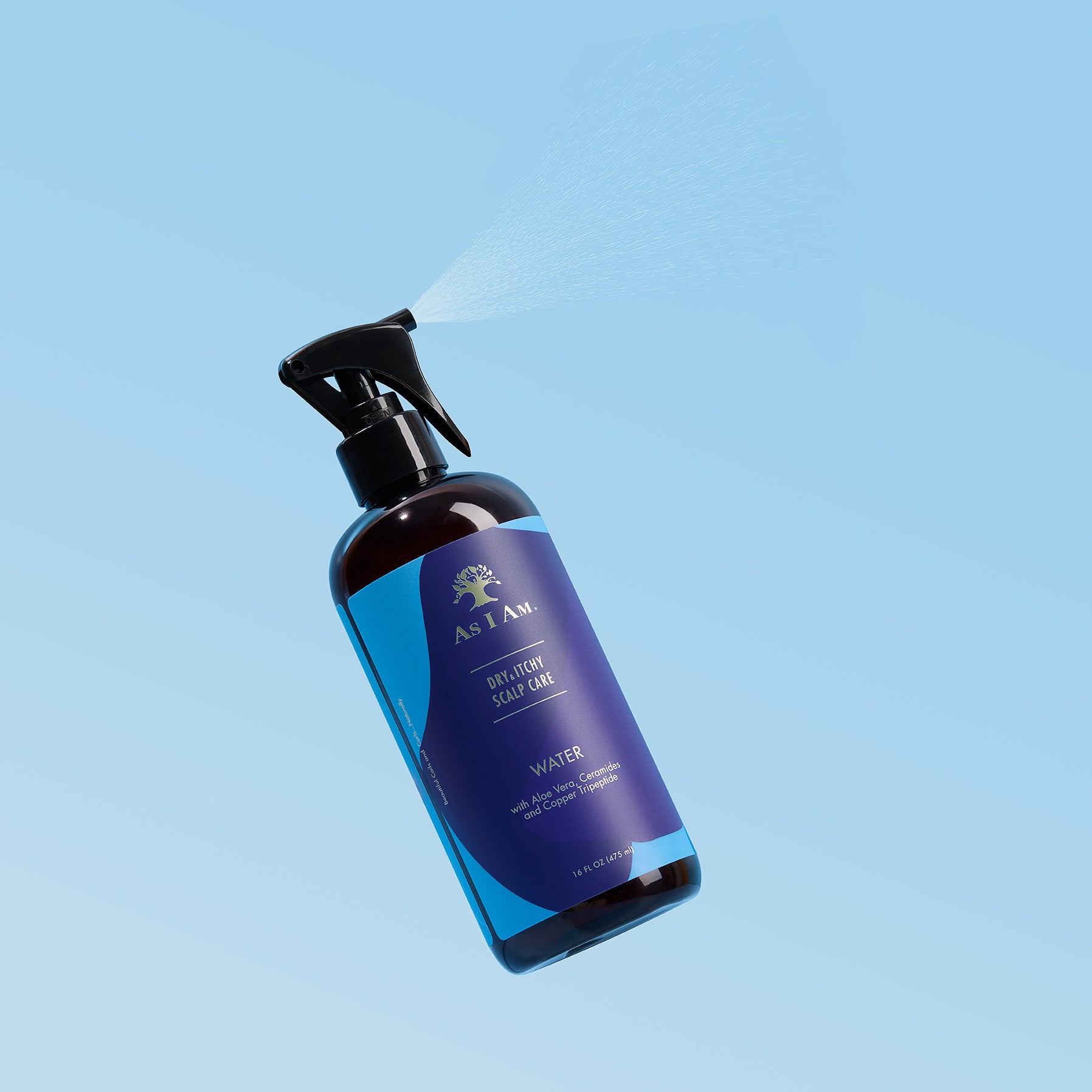 Blue spray bottle with a label on a light blue background