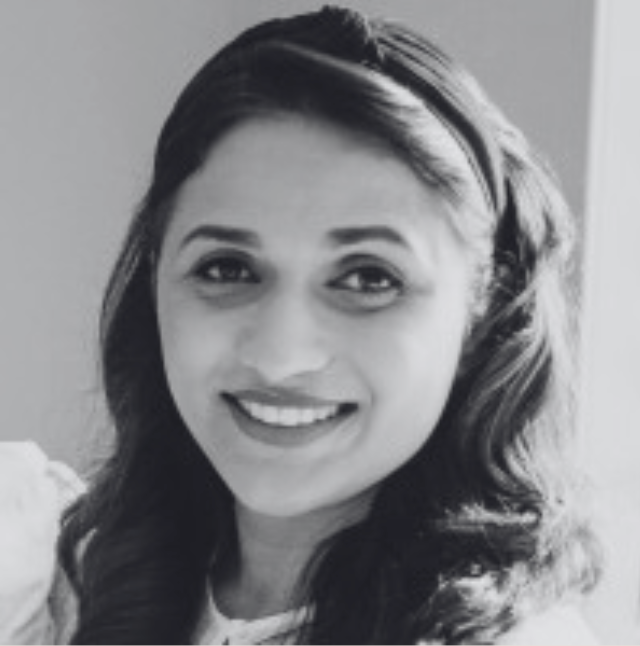 Black and white photo of a woman with a headband