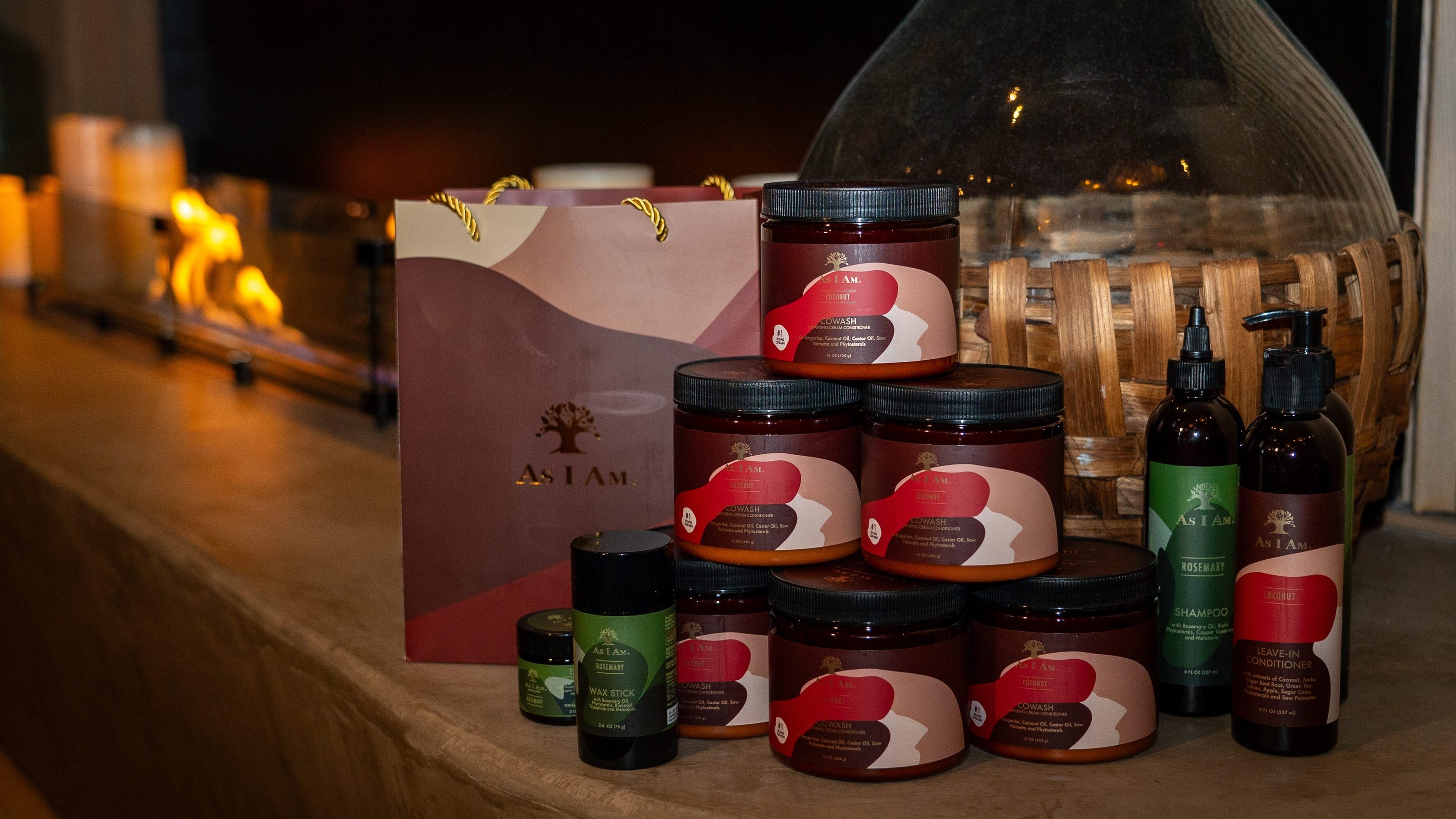 Assorted jars and bottles with a decorative box on a wooden surface.