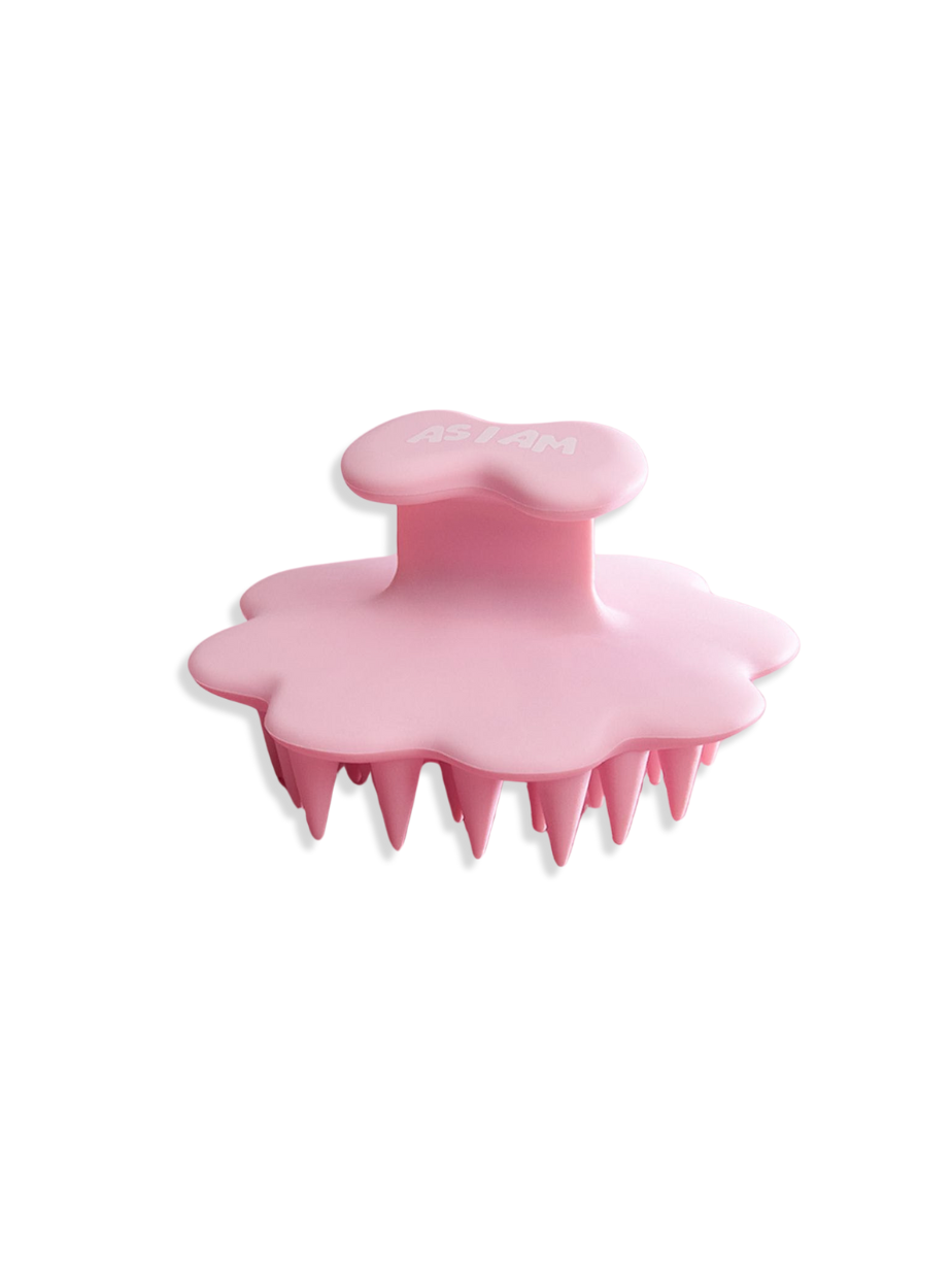 Pink scalp brush on a white background