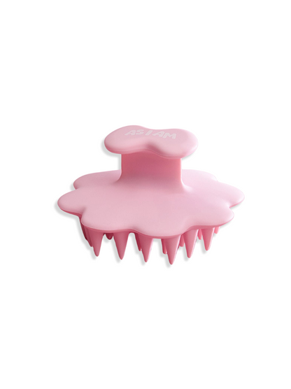 Pink scalp brush on a white background