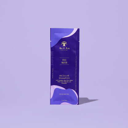 AS I AM Rice Water Shampoo in a 1 oz sachet, featuring a silky, pearly liquid texture—gently cleanses the scalp and hair while promoting hair growth, preventing hair loss, and reducing breakage for stronger, healthier strands.