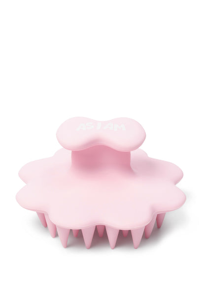 Pink silicone scrubber on a white background
