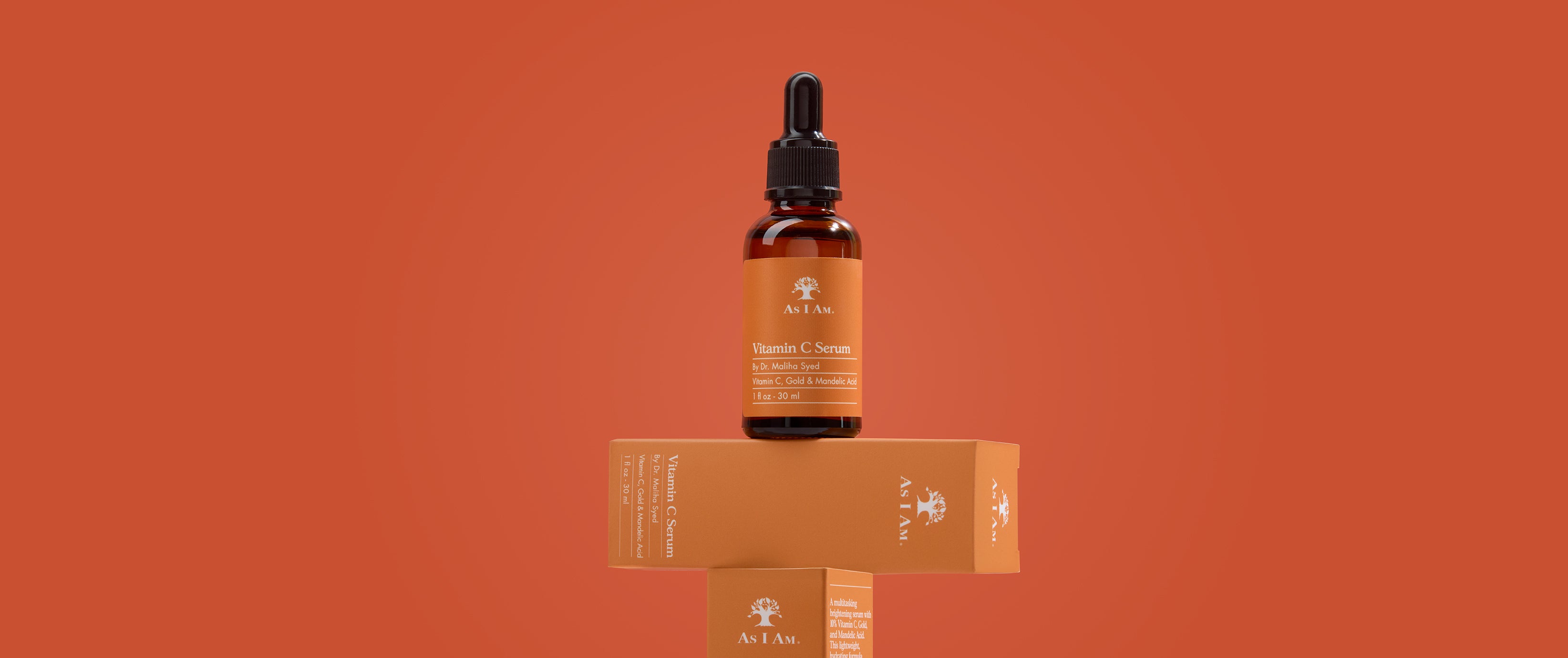 Bottle of Netafim skincare serum with packaging on an orange background