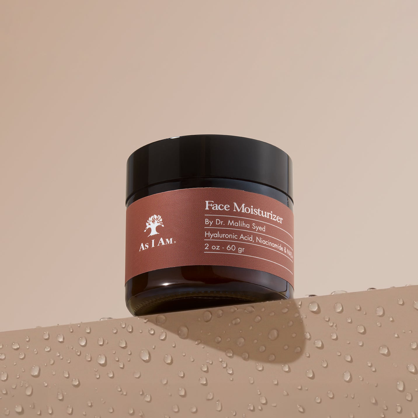 As I Am Face Moisturizer jar on water drop surface