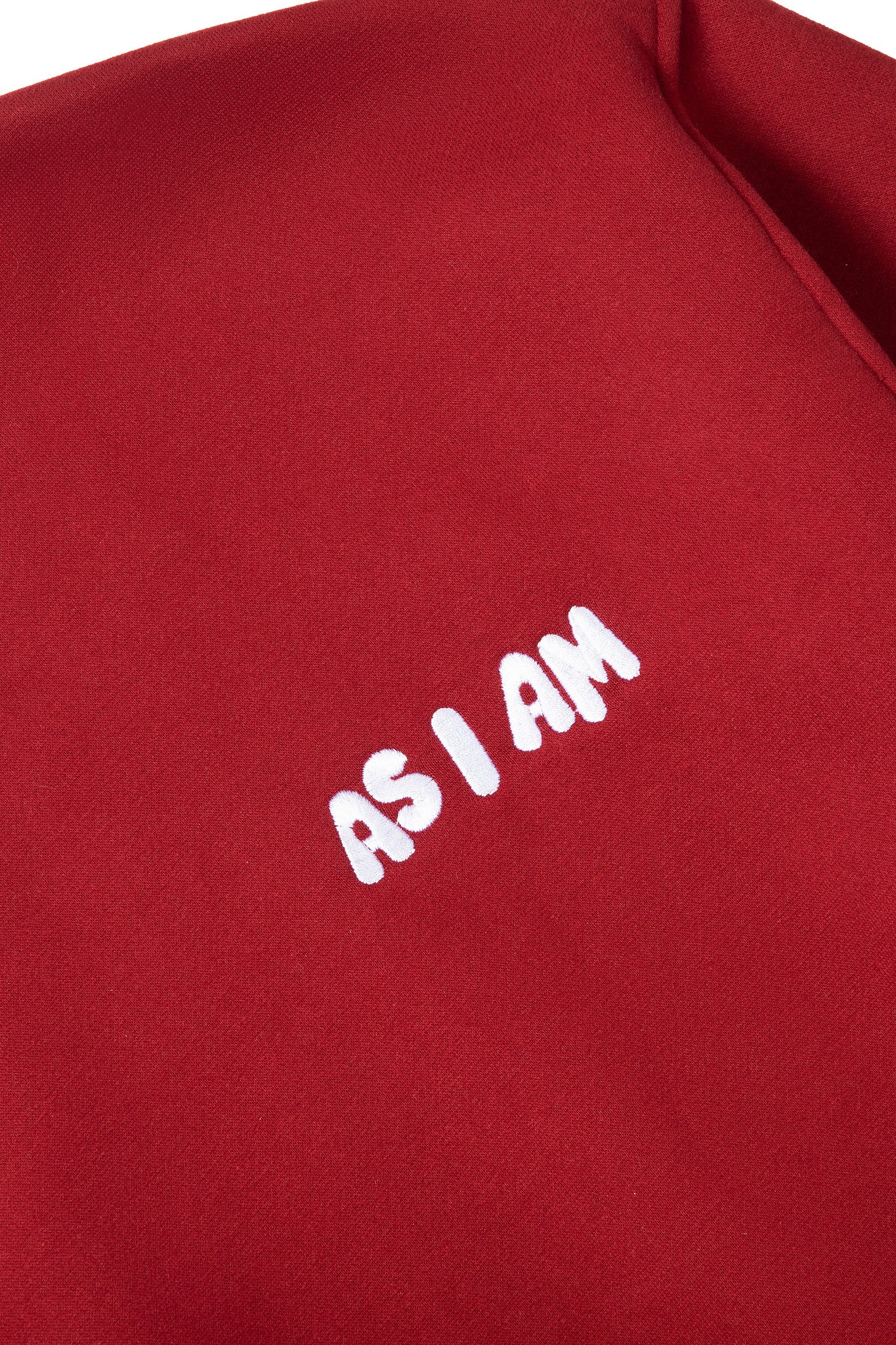 Red sweatshirt with 'AS I AM' text in white on a red background