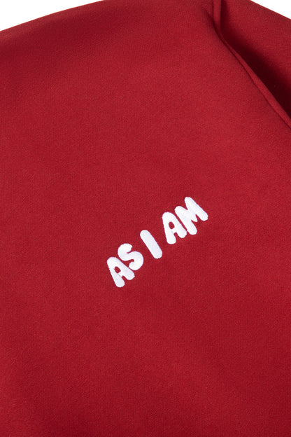 Red sweatshirt with 'AS I AM' text in white on a red background