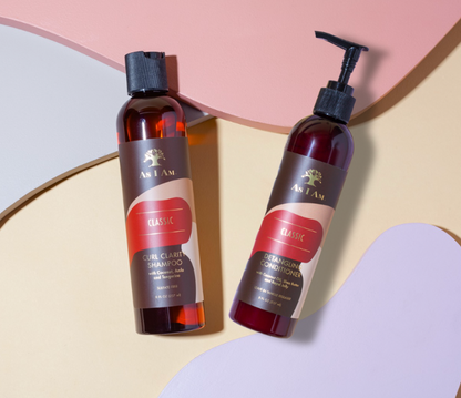 Shampoo and conditioner bottles with a brand logo on a colorful background