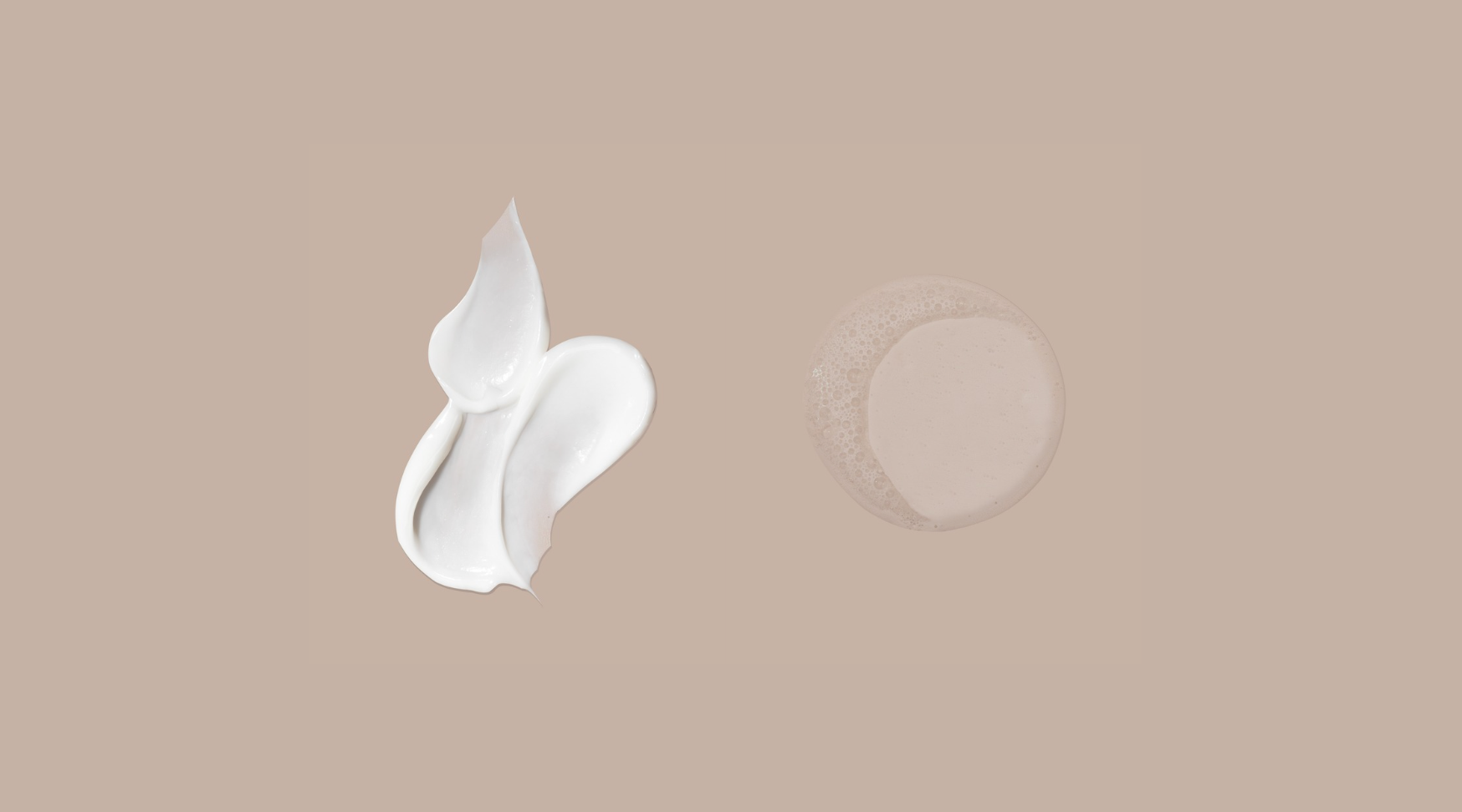 Two white cream swatches on a beige background