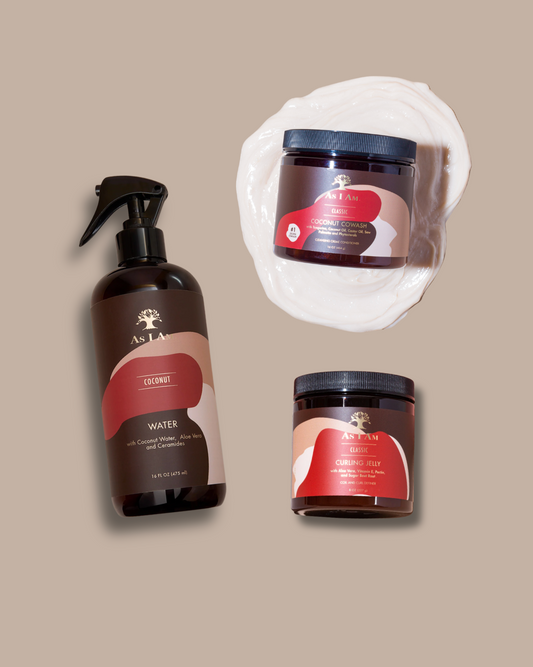 Set of hair care products including a bottle, jar, and mask on a beige background
