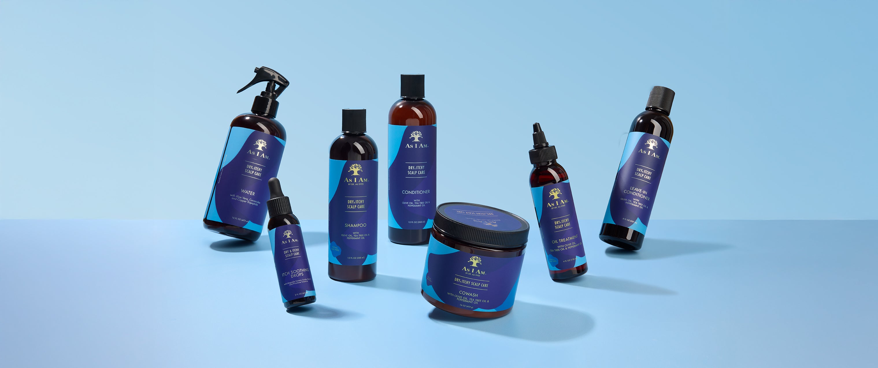 Set of As I Am Dry & Itchy Scalp Care products on a light blue background
