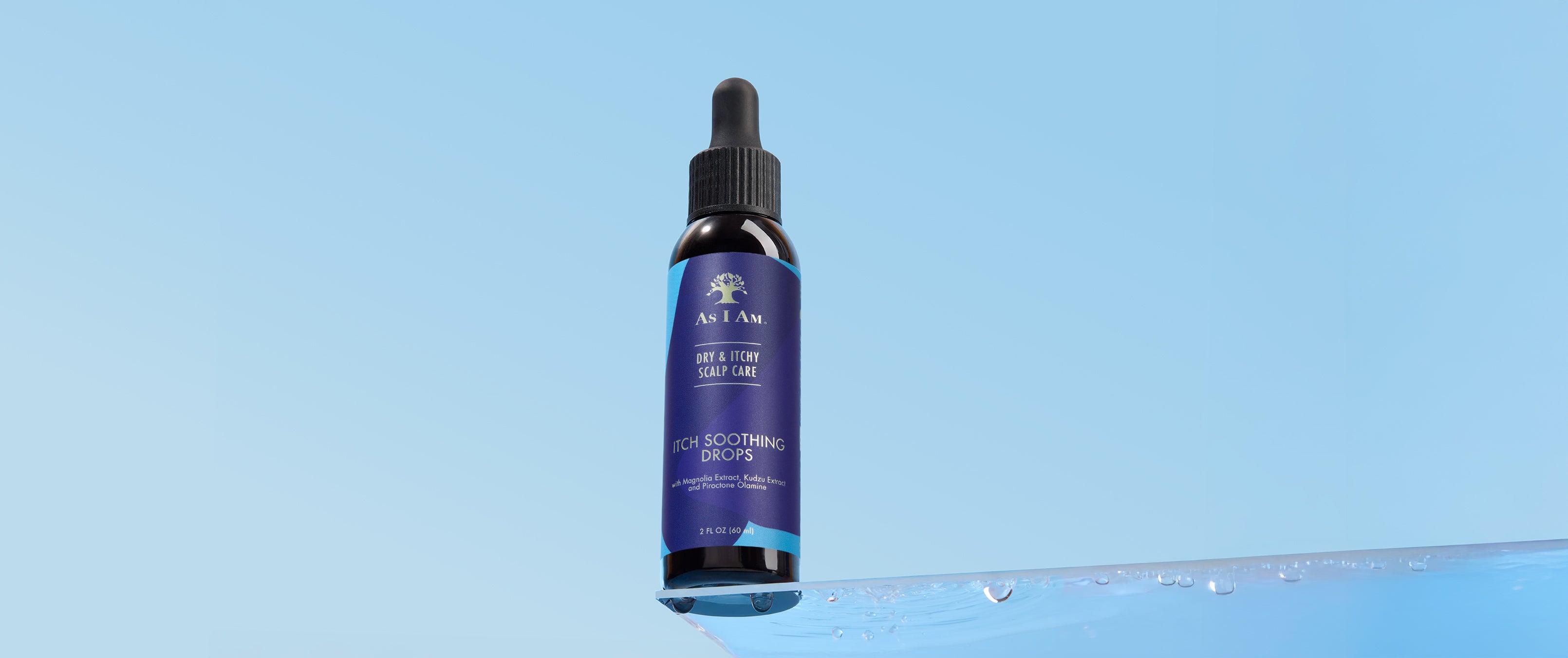 As I Am Itch Soothing Drops bottle on a light blue background with water drops