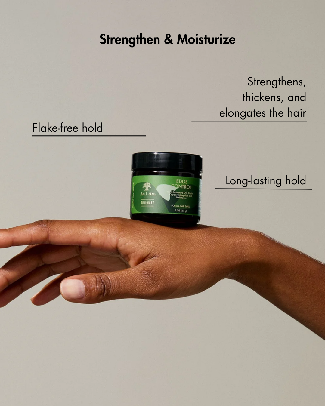Hand holding a green jar of hair product with text about its benefits on a beige background