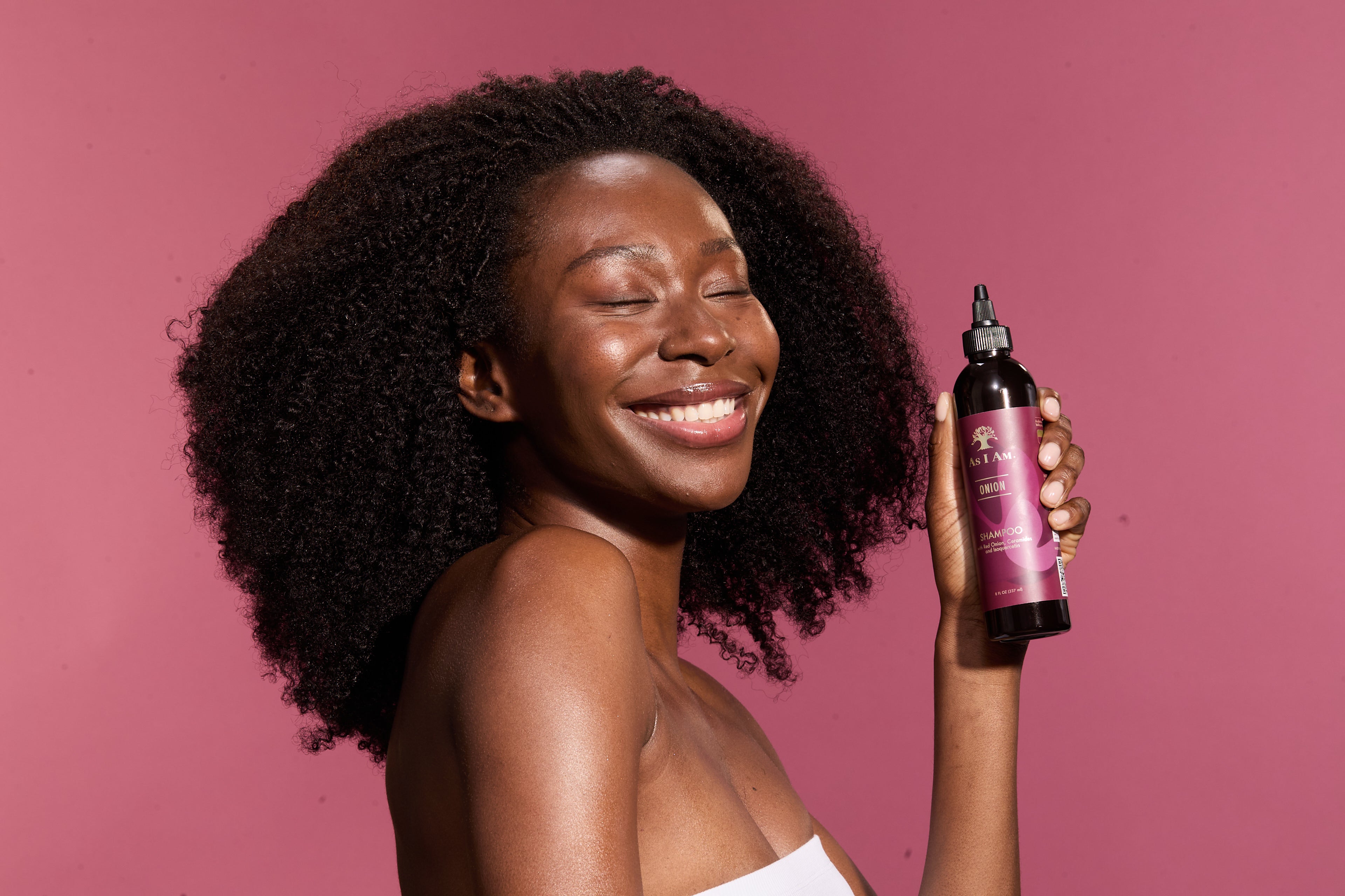 woman holding onion shampoo