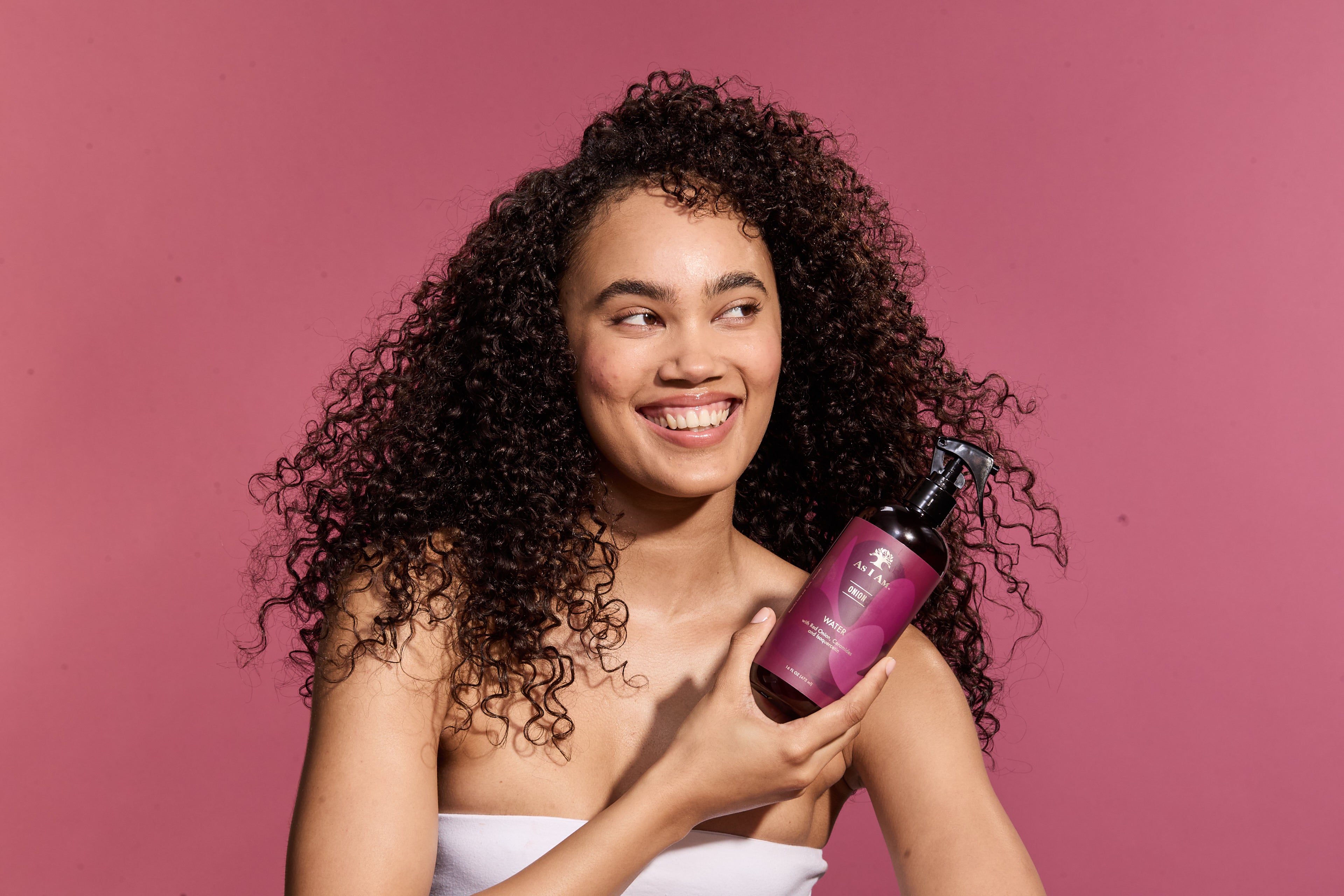 model holding onion water