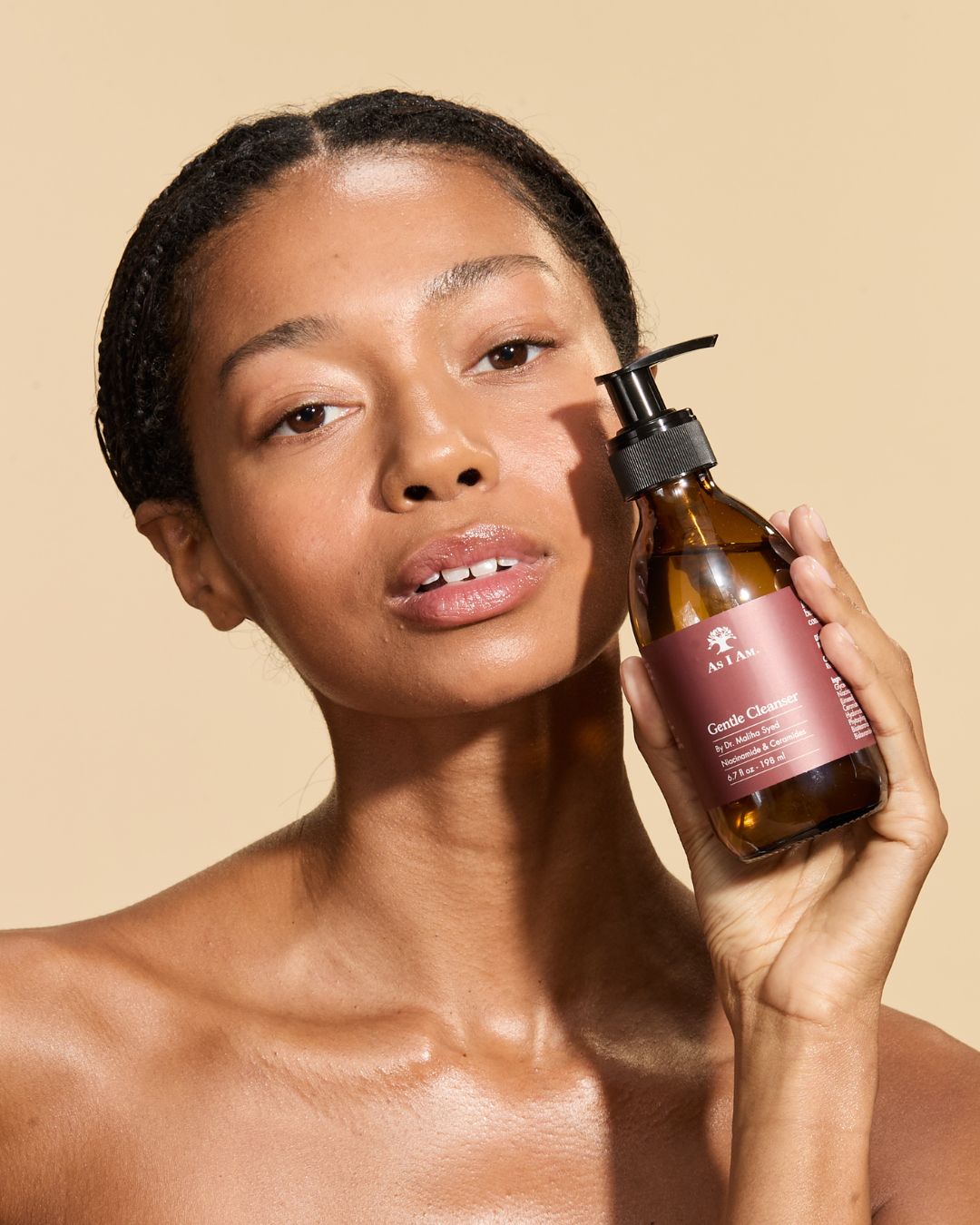 Woman holding the As I Am Gentle cleanser 