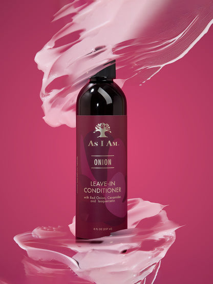 Bottle of As I Am Onion Leave-In Conditioner on a pink background