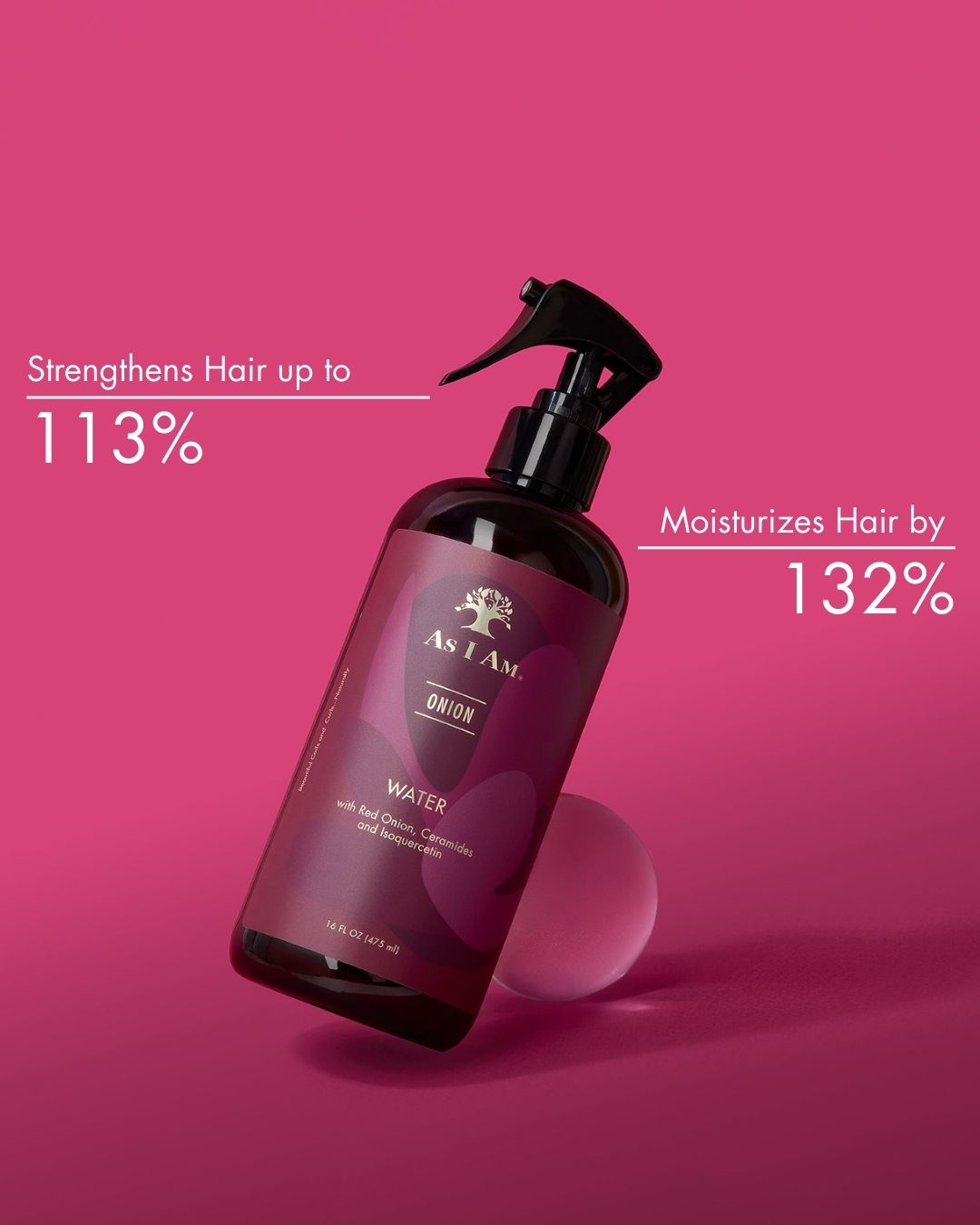 Hair care product bottle with text on a pink background