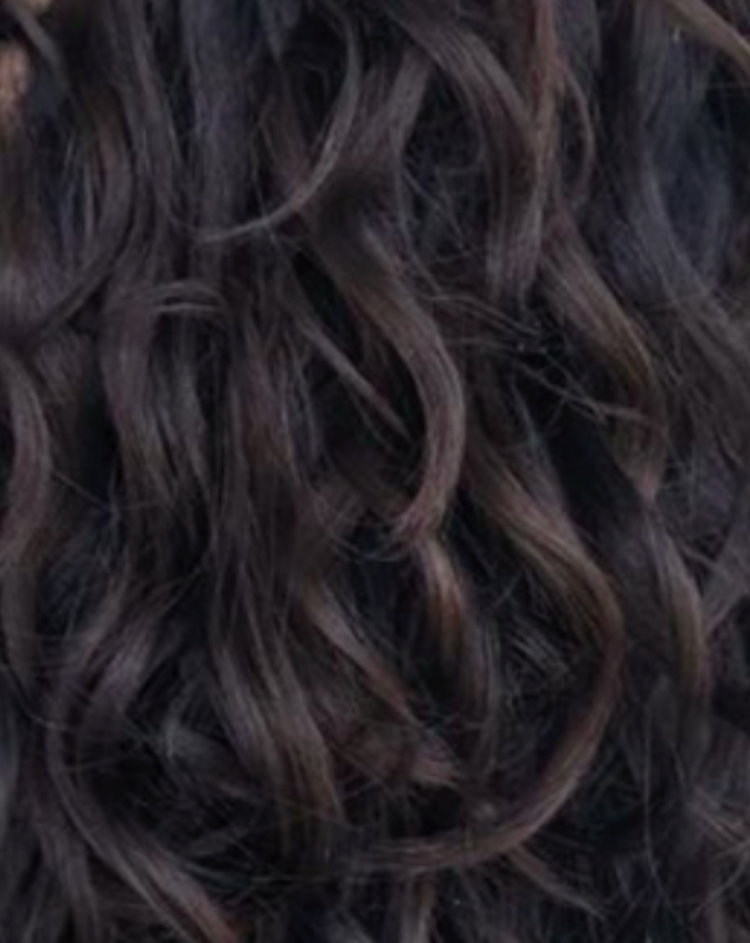 Close-up of dark brown hair with wavy texture