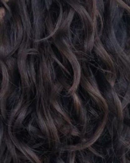 Close-up of dark brown hair with wavy texture