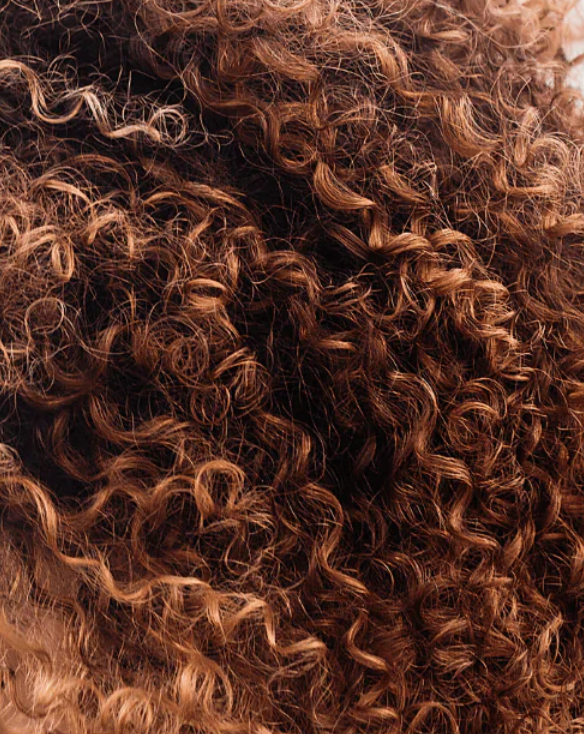 Close-up of curly brown hair texture