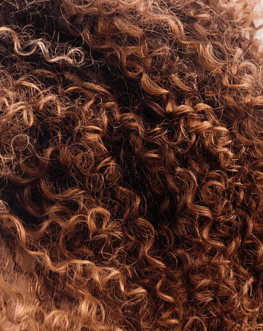 Close-up of curly brown hair texture