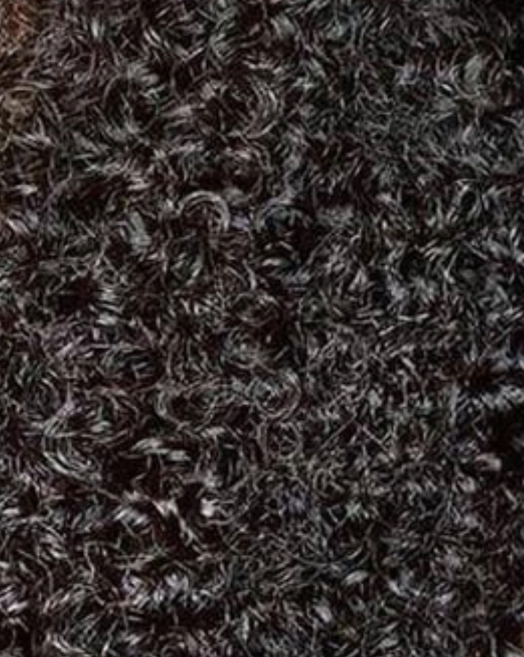 Close-up of dark brown textured hair